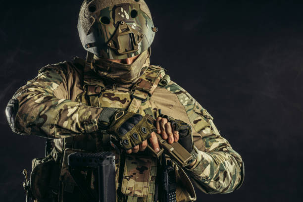 istock handsome fearless brave soldier man with gun 1226341305