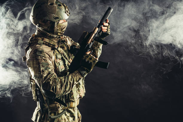istock soldier man shooting through fogger smoke 1226342015