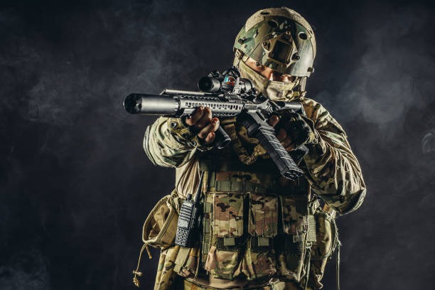 istock soldier aim his weapon at enemy 1226342086