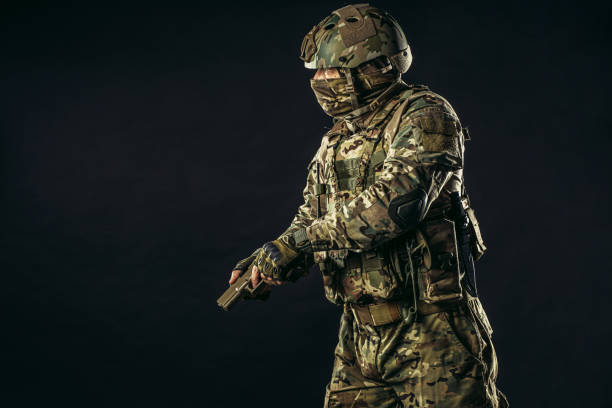 istock handsome fearless brave soldier man with gun 1226342103