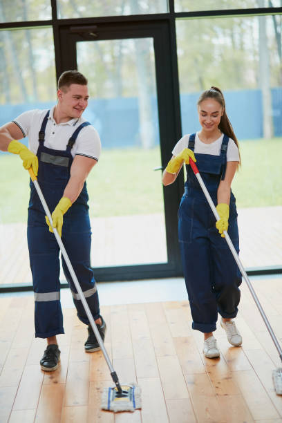 istock Positive janitors with mop cleaning new house 1226344170