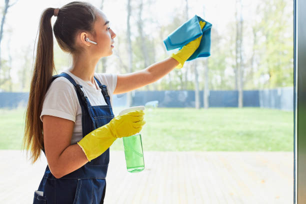istock Modern young cleaning service washing window 1226344854