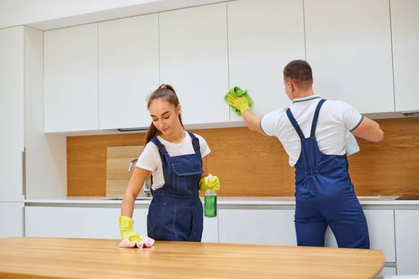 istock Team work of young cleaners in kitchen 1226345014