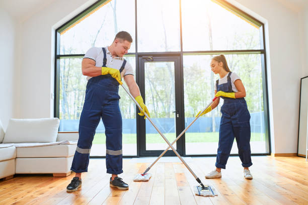 istock Caucasian janitors in uniform mopping floor together 1226346310