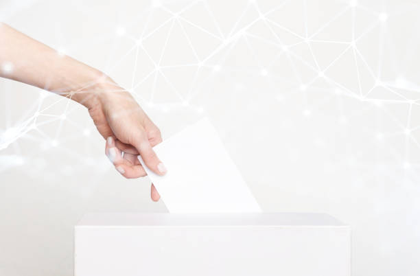 Voter Holding Ballot For Remote Voting stock photo