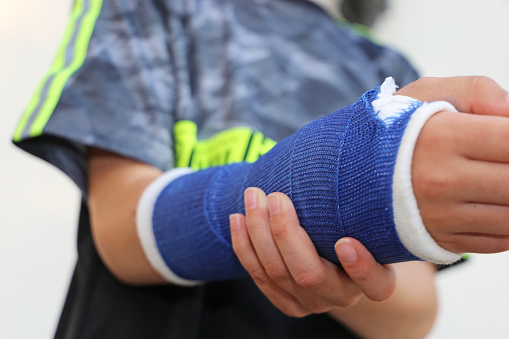 Close up of a boy with plaster arm