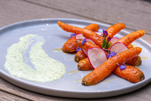 istock Roasted carrots with dill sauce 1226351746