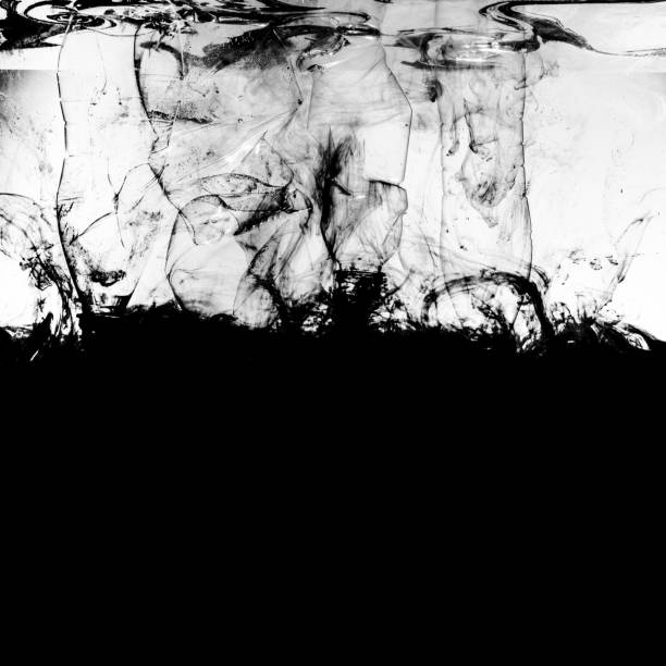 Black Color Liquid and Plastic Bottles in Water .