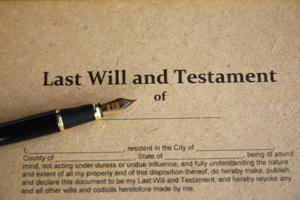 istock Notary's public pen and stamp on testament and last will. Notary public 1226355558