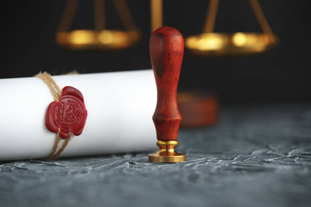 istock Notary public wax seal on old document. Law office 1226356915