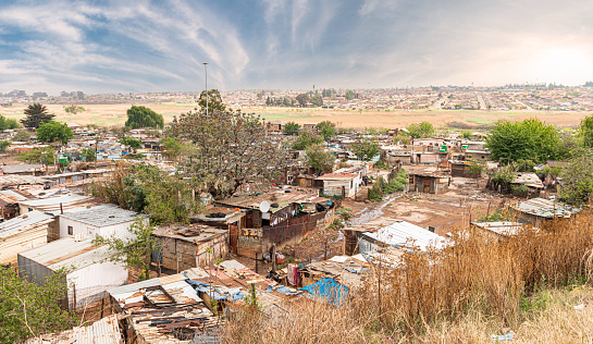 Poor townships next to Johannesburg, South Africa, with a dramatic sky