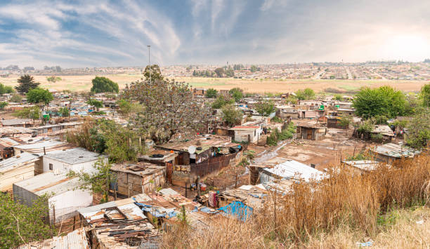 Poor townships next to Johannesburg, South Africa Poor townships next to Johannesburg, South Africa, with a dramatic sky soweto stock pictures, royalty-free photos & images