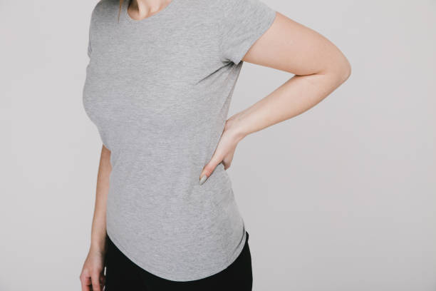 istock Woman feeling backpaine and holding hand on back. 1226360836