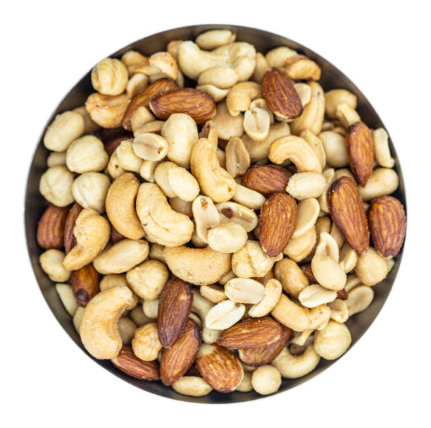 istock Portion of roasted nuts isolated on white (close up; selective focus) 1226362052