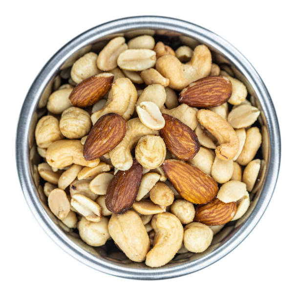 istock Portion of roasted nuts isolated on white (close up; selective focus) 1226362087