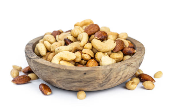 istock Portion of roasted nuts isolated on white (close up; selective focus) 1226362866
