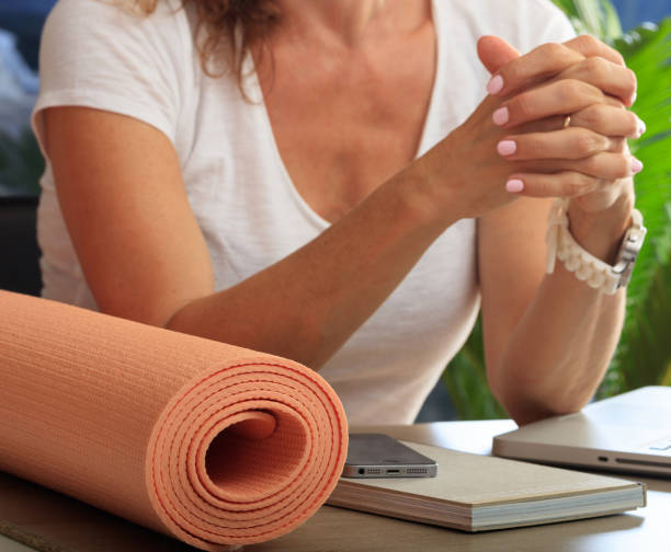 istock Woman and an exercise mat in an office background 1226362905