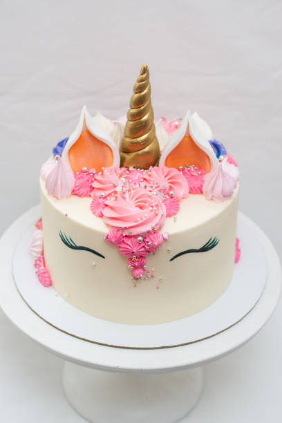 istock Homemade unicorn layered cake decorated with whipped cream. Light grey plain background. 1226363160