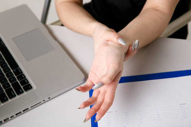 istock Female feeling pain in wrist after working on laptop. 1226371008