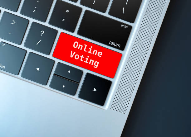 istock Electronic or internet voting concept (e-voting or online voting). Keyboard with red button with online voting written on. 1226373103