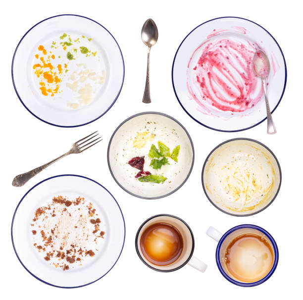 Dirty plates, bowls and cutlery after a meal