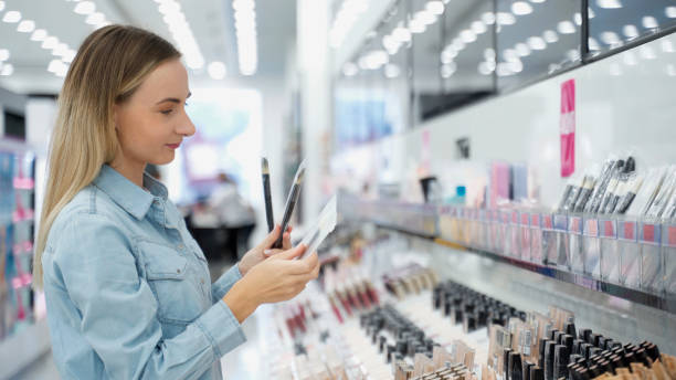 istock Woman chooses makeup brushes in store 1226373434