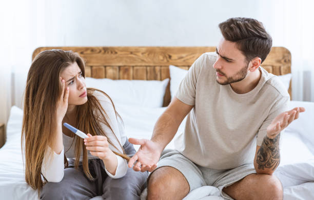 istock Problems with conceiving concept. Frustrated husband and wife sitting on bed 1226374605