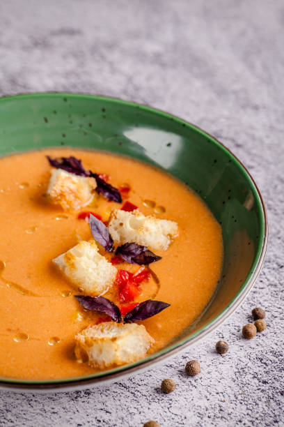 istock Spanish cuisine. Cold summer tomato soup gazpacho with croutons and basil. 1226375843