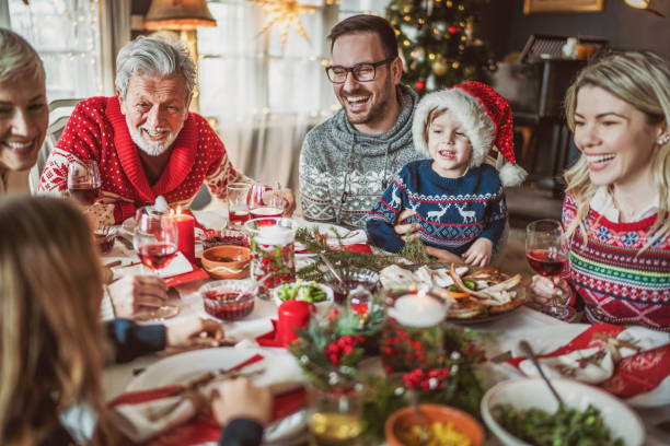 istock Happy extended family having New Year's lunch at dining table. 1226376669