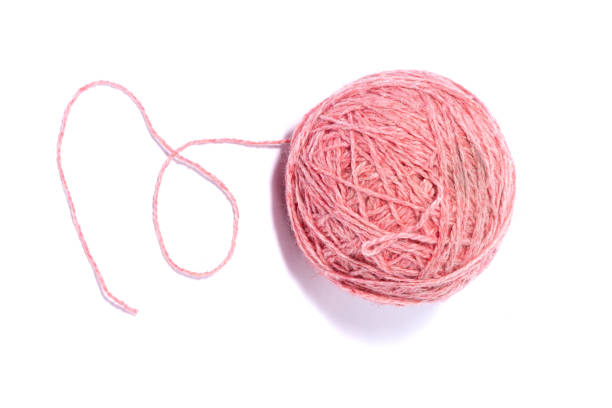 istock ball of woolen pink thread isolated on white background. 1226377591