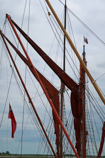 Large number of Thames barge sailing boat masts and rigging. Hythe Quay side on the river Blackwater estuary. Overcast spring day. Maldon, Essex, United Kingdom,