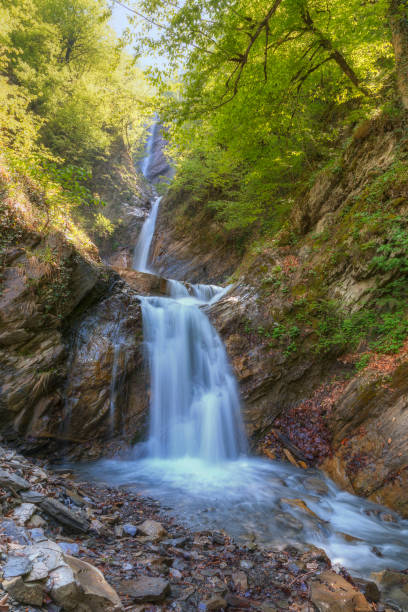 istock Three-stage waterfall in the spring in the mountains 1226379487