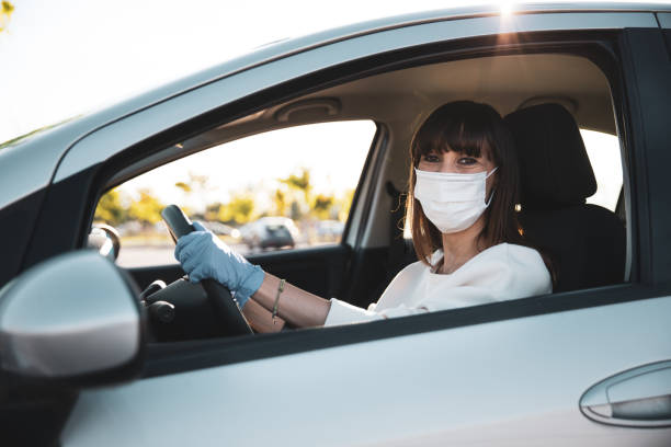 istock Woman driving to work during pandemic days 1226379532