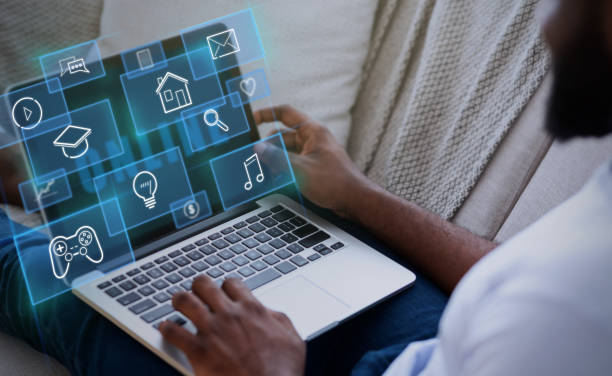 istock Internet life. African American guy with laptop at home, creative collage with various functional pictograms 1226380532