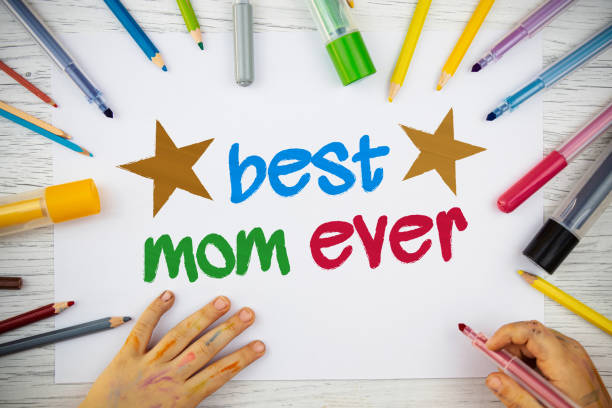 istock Little girl is drawing about Best Mom Ever 1226381075