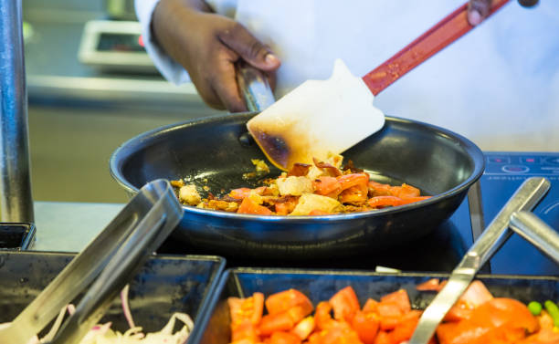 istock Chef Sauteeing Food 1226381174