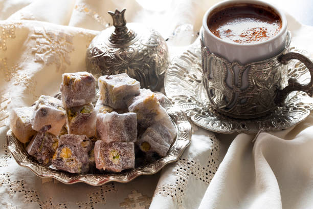 Turkish delight with coffee and traditional silver serving set. Feast of Ramadan. stock photo