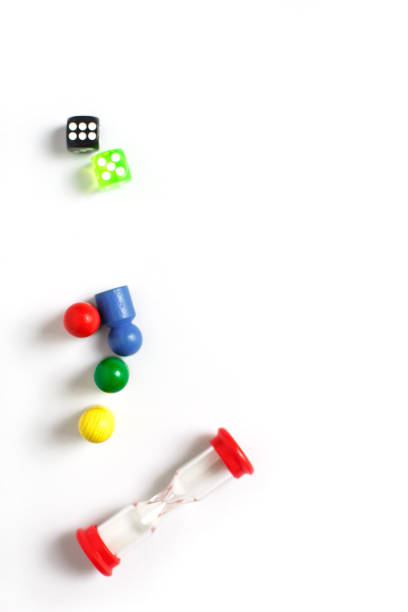 Game cubes, chips, hourglass on a white background. T
