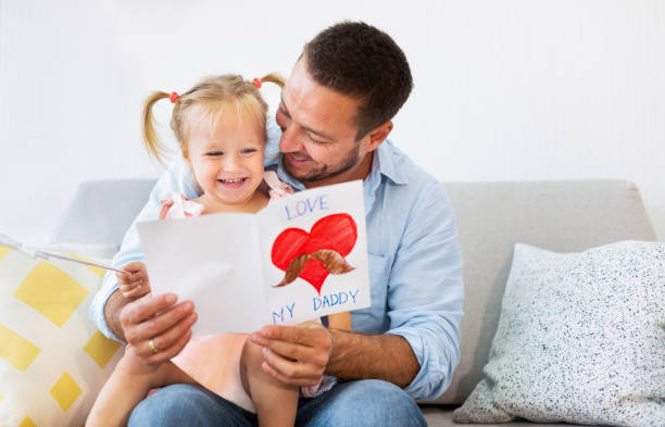 istock Little daughter congratulating dad with father's day 1226384414