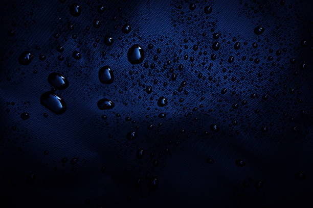 istock Water drops on the dark fabric.water drops on dark 1226386265