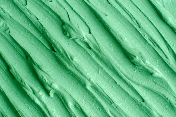 istock Green cosmetic clay (kelp facial mask, face cream, spirulina body wrap) texture close up, selective focus. Abstract background with brush strokes. 1226388693