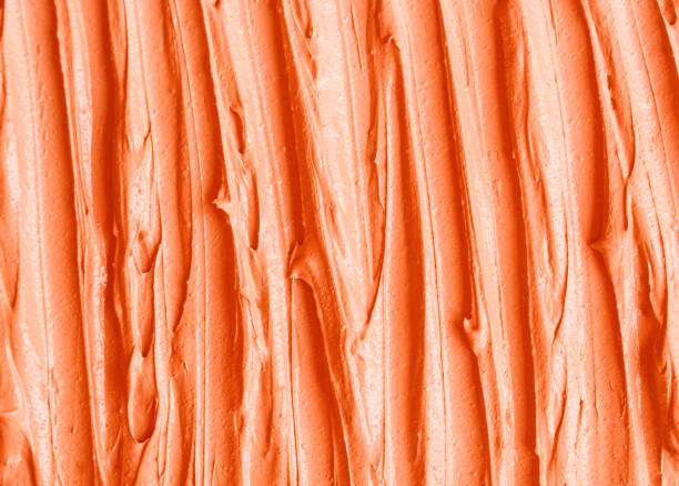 istock Orange pumpkin mask (facial cream, turmeric body scrub) texture close up, selective focus. Abstract background with brush strokes. 1226388871