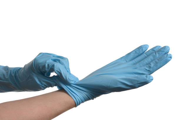 istock Hand with blue protective glove isolated on white background 1226388986