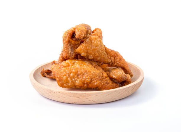 crispy fried chicken skins on wooden plate. fried chicken skin on white background. snack and appetizers - asia cooked food gourmet imagens e fotografias de stock