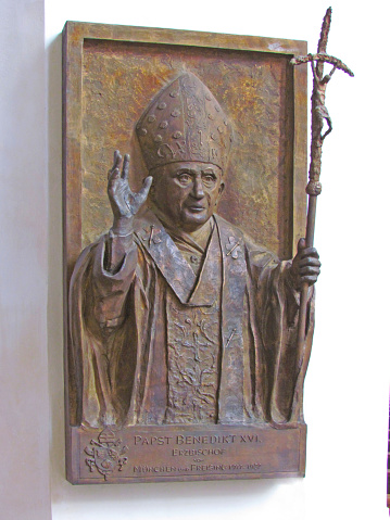 A memorial plaque to Pope Benedict XIV in the Frauenkirche Church, where he previously served as a Bishop. Germany, Munich, August 2013