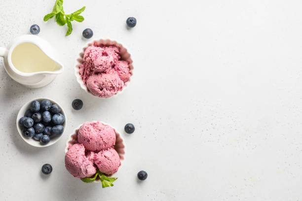 istock Blueberry ice cream in bowls on white. Space for text. View from above. 1226392943