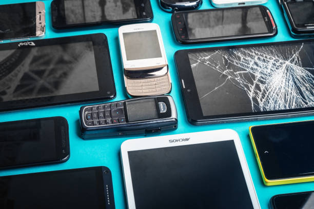 istock dirty, broken and old smartphones on a blue background 1226396230