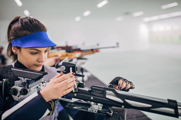 istock Young girl on rifle shooting practice 1226396378