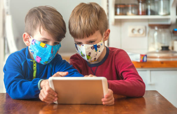 istock Boys Playing With Digital Tablet At Home 1226397494