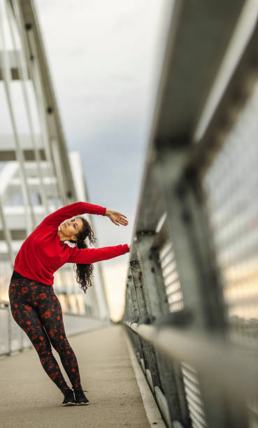 istock Woman stretching outdoors 1226397797